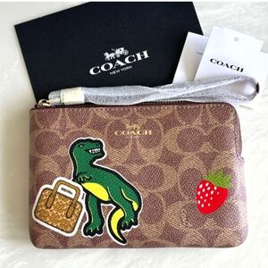 Coach signature leather dinosaur corner zip wristlet NEW WITH TAGS!